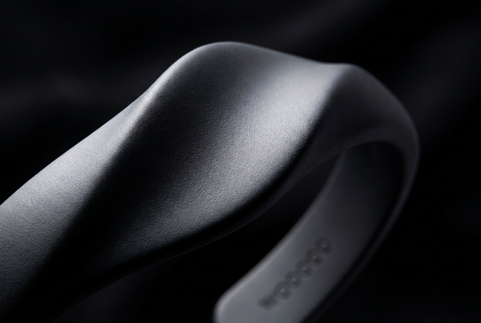 Macro of the soft-touch matte crest and the debossed wooooo mark